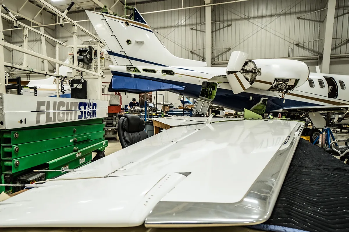 Bombardier Learjet 45 undergoing aircraft maintenance inspection with horizontal tail removal at Flightstar in Savoy Illinois